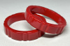BB727  matching pair of ruby red groove carved bakelite bangles